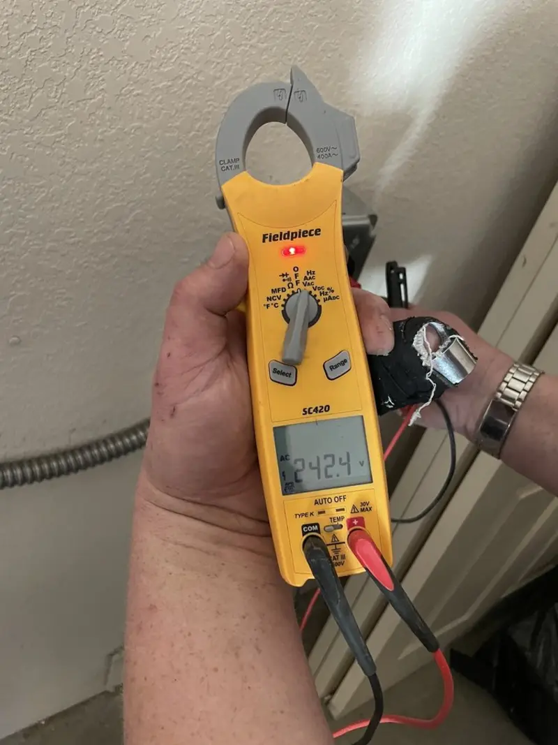Voltage testing with clamp meter during Aluminum Wiring Replacement in St. Clair